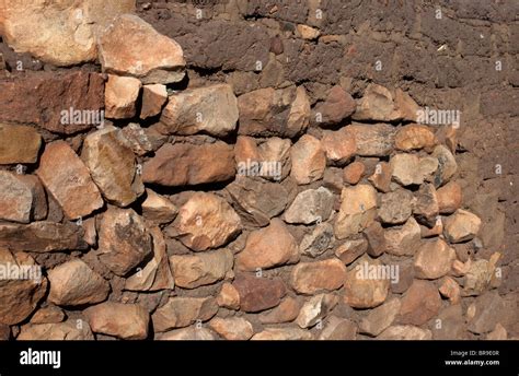Stone And Adobe Mud Brick Form A Contrast Of Building Materials For