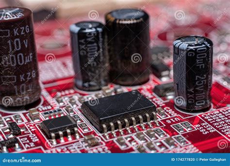 Computer Chip With Transistors On A Red Motherboard Stock Photo Image