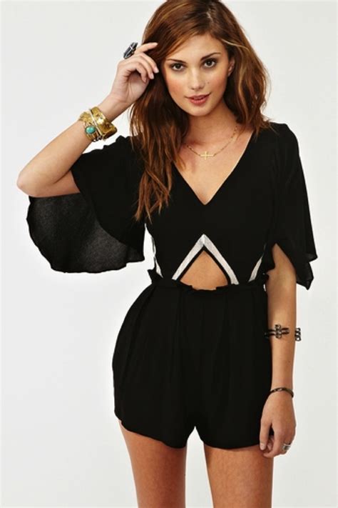 A Black Romper With Cutouts And Batwing Sleeves Sheer Brilliance