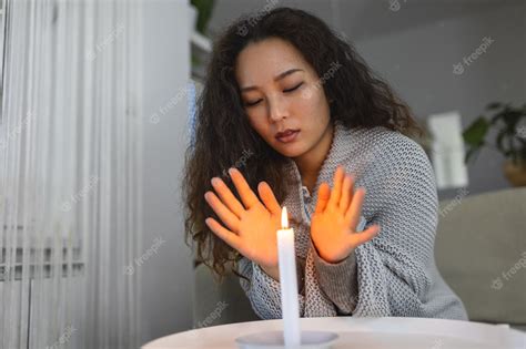 Premium Photo Burning Candle Women Trying To Heat Her Hands In Dark