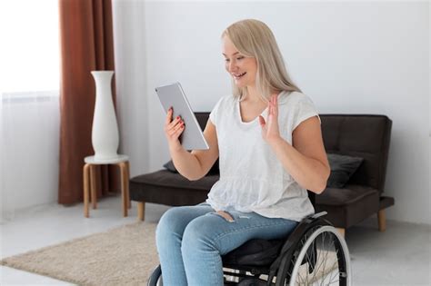 Free Photo Disabled Person In Wheelchair Using Digital Device