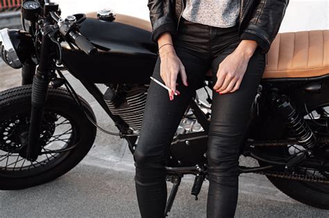 Young Woman On Motorcycle Smoking Sigarette Stock Photo Download