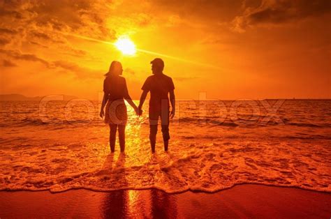 Happy Couple At Sunset On The Beach Stock Image Colourbox