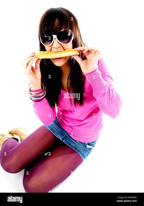 Teenage Girl Eating Sausage Roll Model Released Stock Photo Alamy