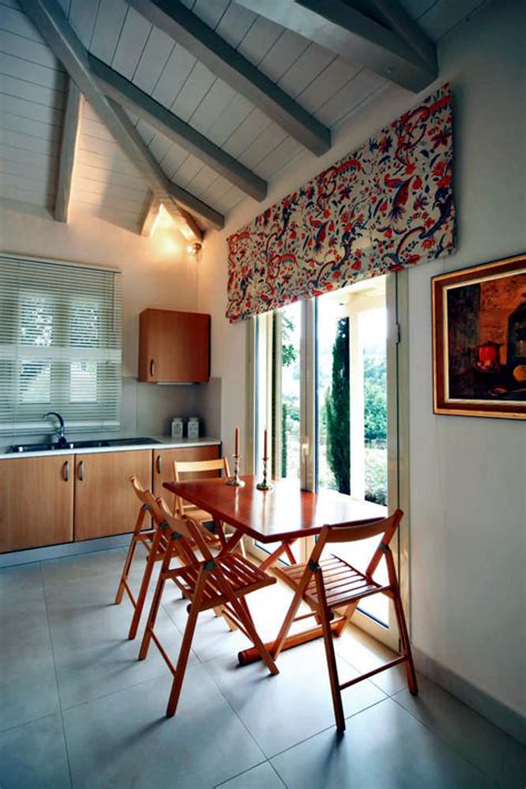 For a smaller space with an open dining area, sara likes to turn the dining table into an everyday comfort space. Sitting area off the kitchen table and folding chairs ...