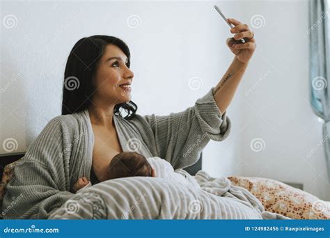 Breastfeeding Mother Taking A Selfie Stock Photo Image Of Eating