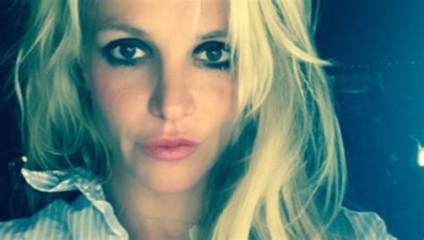 britney spears pulls down shorts with no visible underwear in stunning backyard video