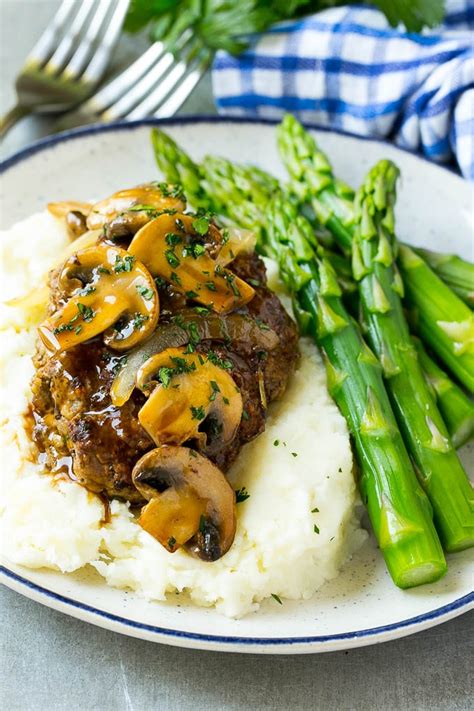 Large patties flavored to perfection and covered in a rich onion and mushroom. Slow Cooker Salisbury Steak - Dinner at the Zoo
