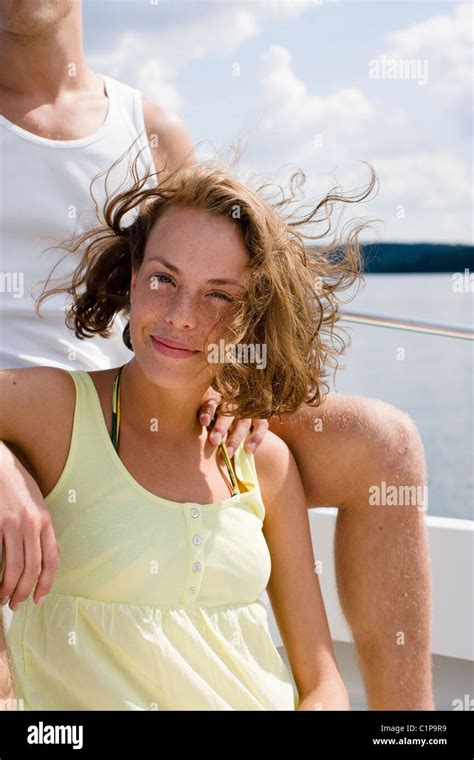 Portrait Of Woman Relaxing In Boat On Sea Stock Photo Alamy