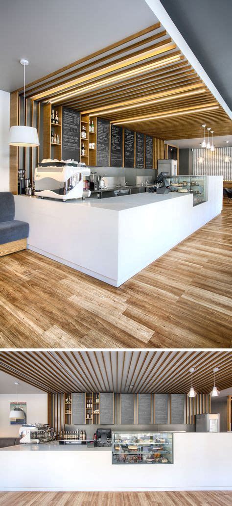 This cafe service counter mixes white counters with glass, wood