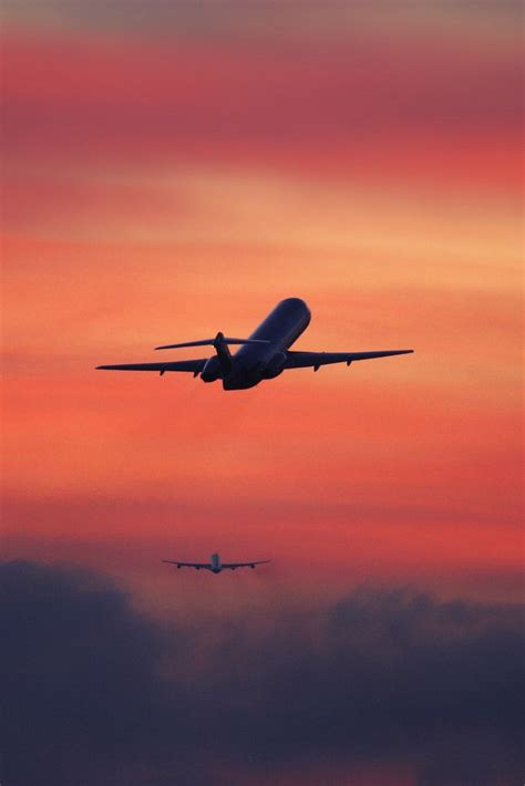 Two Airplanes Flying Away After Take Off In The Sunset Flickr