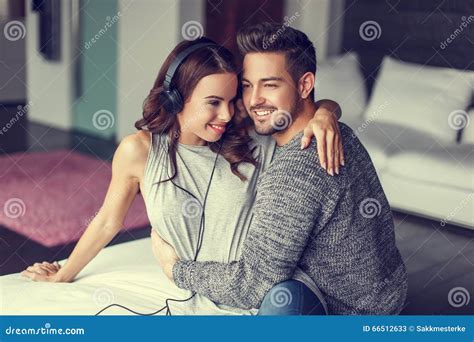 Happy Young Couple Listening To Music Indoor Stock Image Image Of