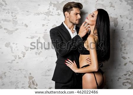 Handsome Man In Black Suit Touching Sexy Woman In Lingerie Stock Photo Shutterstock