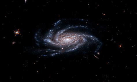 The Spiral Galaxy Ngc 2008 Sits Center Stage Its Ghostly Spiral Arms