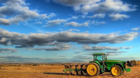 Download Wallpaper 1920x1080 Tractor Field Plowing Clouds