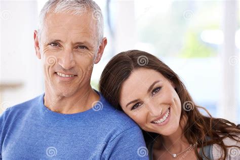 So In Love A Young Woman Resting Her Head On Her Mature Husbands Shoulder Stock Image Image