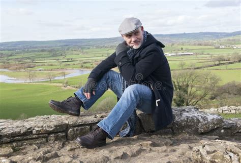 Happy Mature Man Sitting Stone Wall Stock Photos Free And Royalty Free