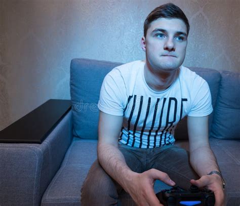 Male Gamer Playing A Video Game At Home Stock Image Image Of