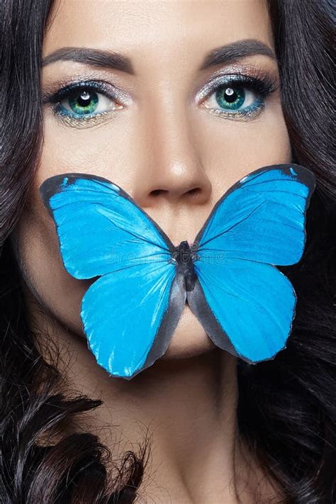 Beautiful Mysterious Woman With Butterflies Blue Color On Her Face