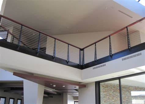 Wood railing designs for decks can use a continuous 2×6 to cap the posts. Modern Stair Railing and Balcony Railing - Las Vegas, NV - Keuka Studios