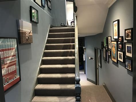 Staircase And Landing With Gallery Wall Blue Walls