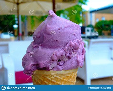 Purple Color Fruit Flavored Ice Cream Closeup In Plain Waffel Cone