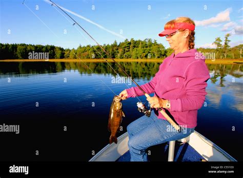 Mature Woman Bass Fishing In A Lake Stock Photo Alamy
