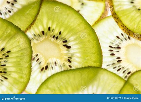 Macro Photo Of A Beautiful Delicious Kiwi Sliced In Circles With Back Light On The Lumen Top