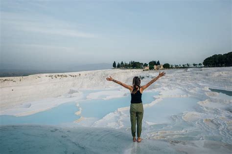 Tourist Girl On Travertine Pools And Terraces In Pamukkale In