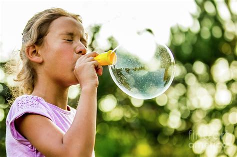 Girl Blowing Bubbles Photograph By Science Photo Library Fine Art America