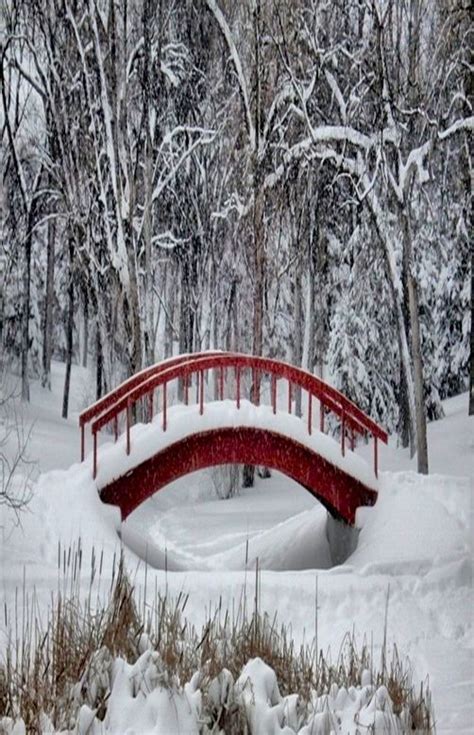 Red Painted Iron Bridge In Snow Winter Wonderland