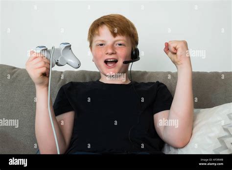 Happy Child With Joystick Playing Videogames At Home Stock Photo Alamy