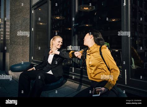 Women Greeting Using Elbows Stock Photo Alamy