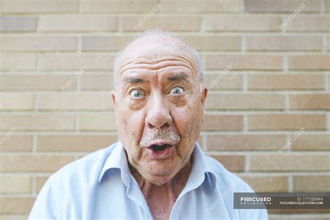 Portrait Of Senior Man Pulling Funny Faces — Head And Shoulders