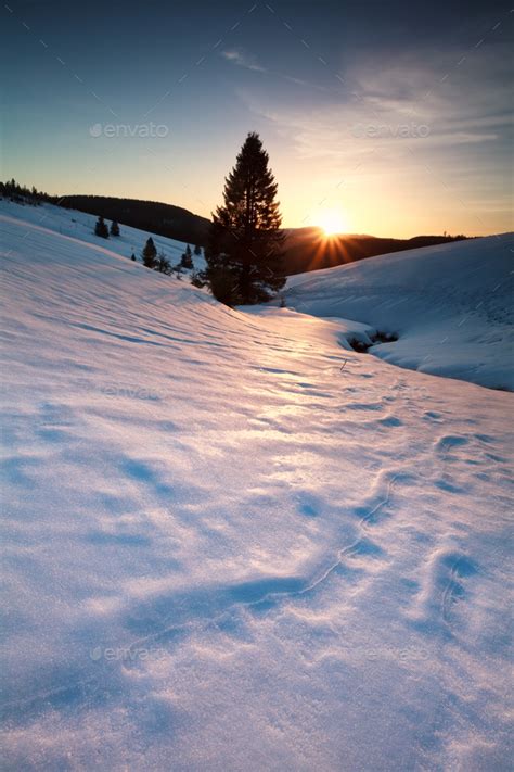 Sunset Over Snowy Mountains Stock Photo By Catolla Photodune