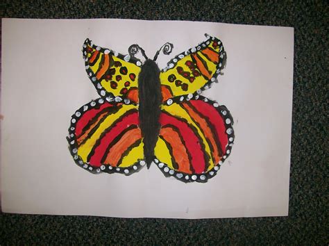 Open the paper plate back up, and admire your gorgeous, symmetrical pattern. Louise Morgan: Symmetry Butterflies!