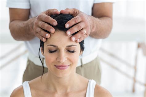 Pregnant Woman Receiving A Head Massage From Masseur At Home