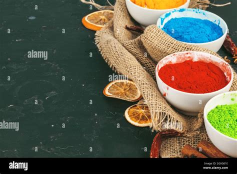 Traditional Indian Holi Colours Powder Spices On Dark Rustic
