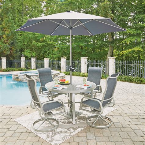 An elegant metal frame patio dining set that seats six, instantly adds warmth to your patio, garden, backyard space. South Beach 7 Pc. Round Outdoor Dining Table & 4 Swivel ...