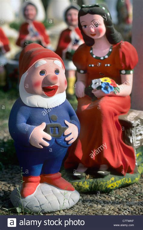 Garden Gnome And Snow White Stock Photo Royalty Free
