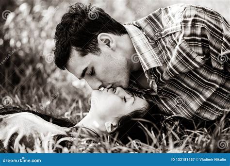 Man And Woman Kissing And Lying On Grass Stock Image Image Of Grass Dream 132181457