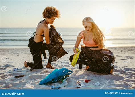 Girls Picking Up Trash From The Beach Stock Image Image Of Litter