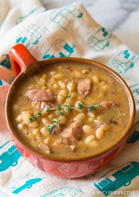 Using the back of a spoon, mash the garlic halves against the side of the slow cooker to squeeze the soft cloves out and stir into the soup. Nana's Epic Navy Bean Ham Bone Soup (Video) - A Spicy ...