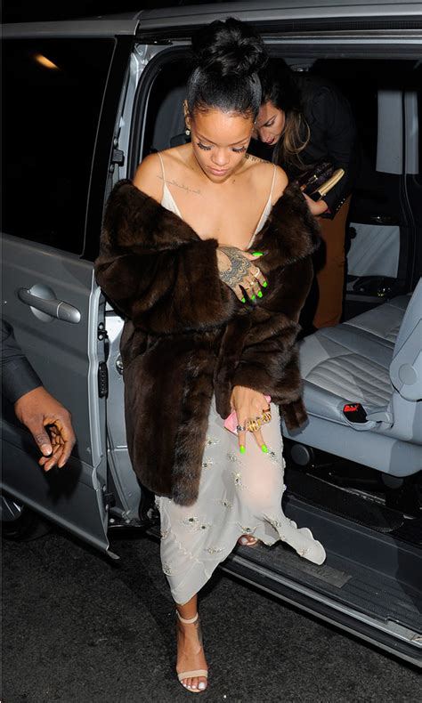PIC Rihannas Nip Slip At British Fashion Awards RiRis Wardrobe Malfunction Hollywood Life