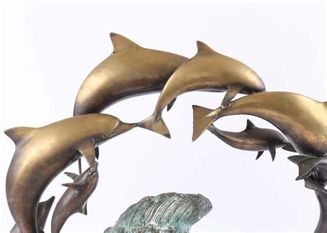 Aged Brass Leaping Dolphins Sculpture Ebth