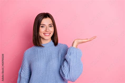 Photo Of Pretty Cheerful Person Arm Palm Hold Demonstrate Empty Space