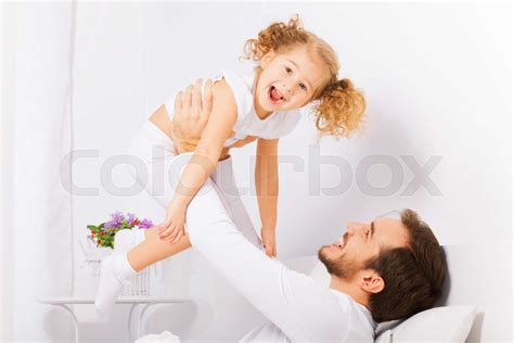 Father Holds With Arms His Laughing Daughter Stock Image Colourbox