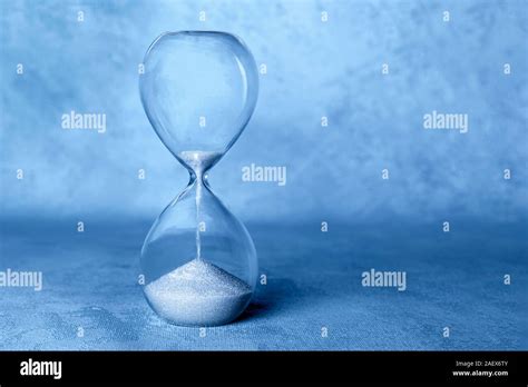 Time Is Running Out Concept An Hourglass With Sand Falling Through With Copy Space Toned In