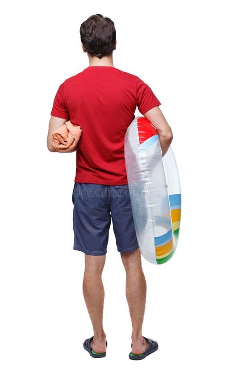 Back View Of A Man In Shorts With An Inflatable Circle Stock Image Image Of Back Outdoors