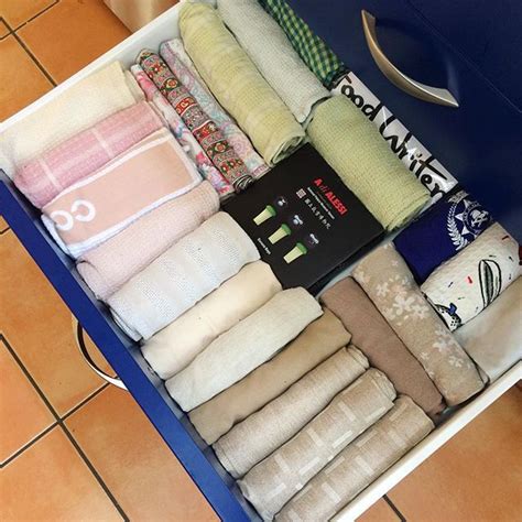 Want to fold towels like marie kondo? Marie Kondo style tea towel draw | Tea towels, Towel, Tidying